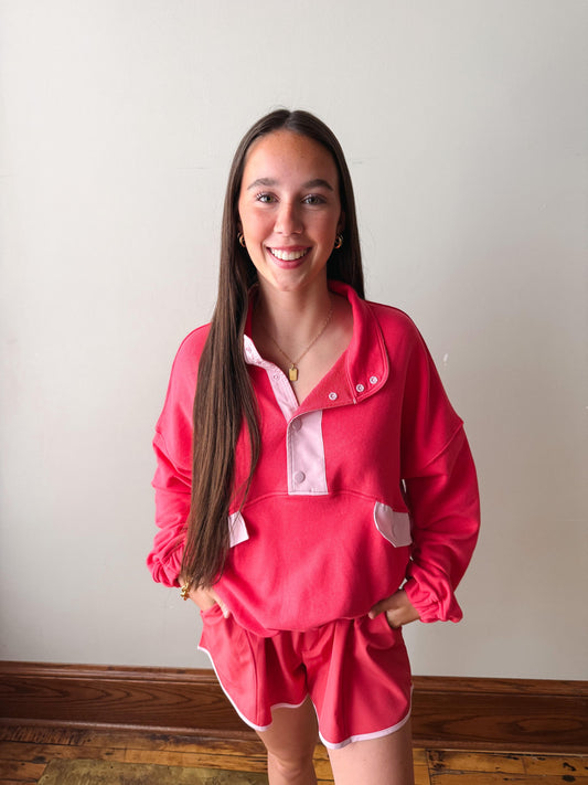 Woman wearing a pink outfit with a white background