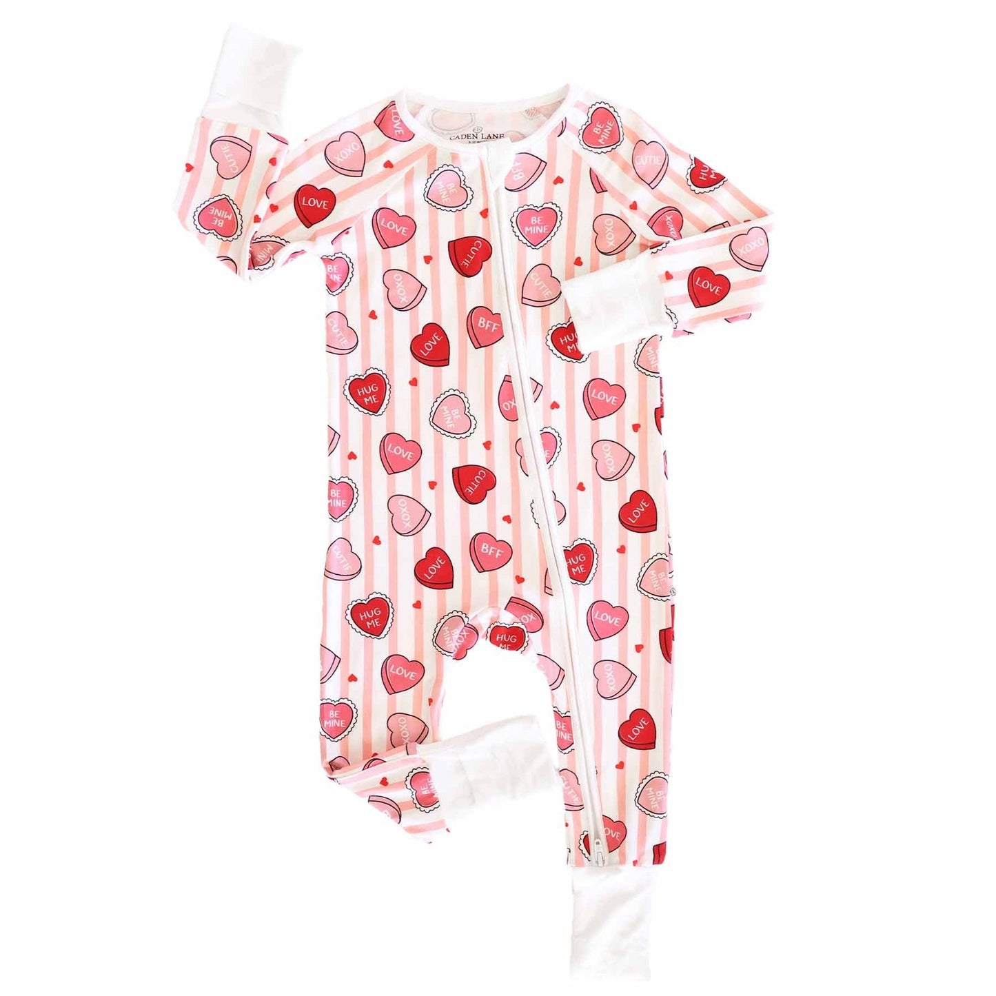 Baby onesie with heart pattern on a white background