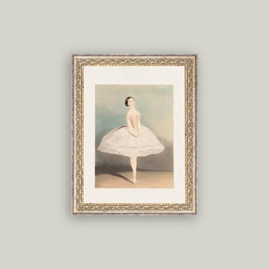 Framed artwork of a ballerina on a gray wall