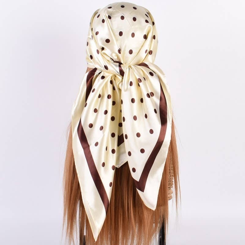 Beige headscarf with brown polka dots on a white background