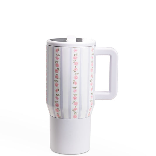 White travel mug with floral pattern on a white background