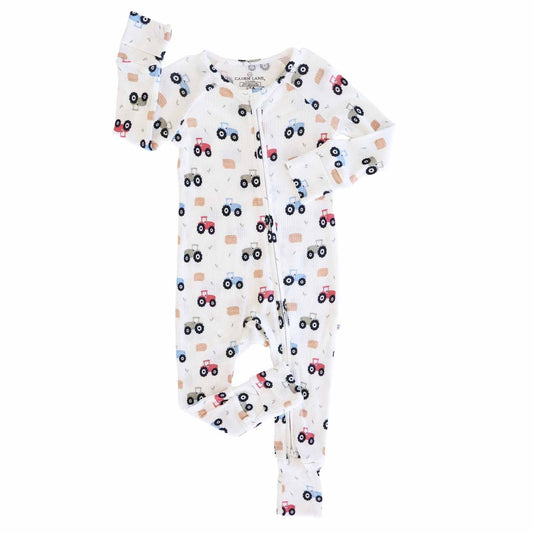 Baby onesie with vehicle pattern on a white background