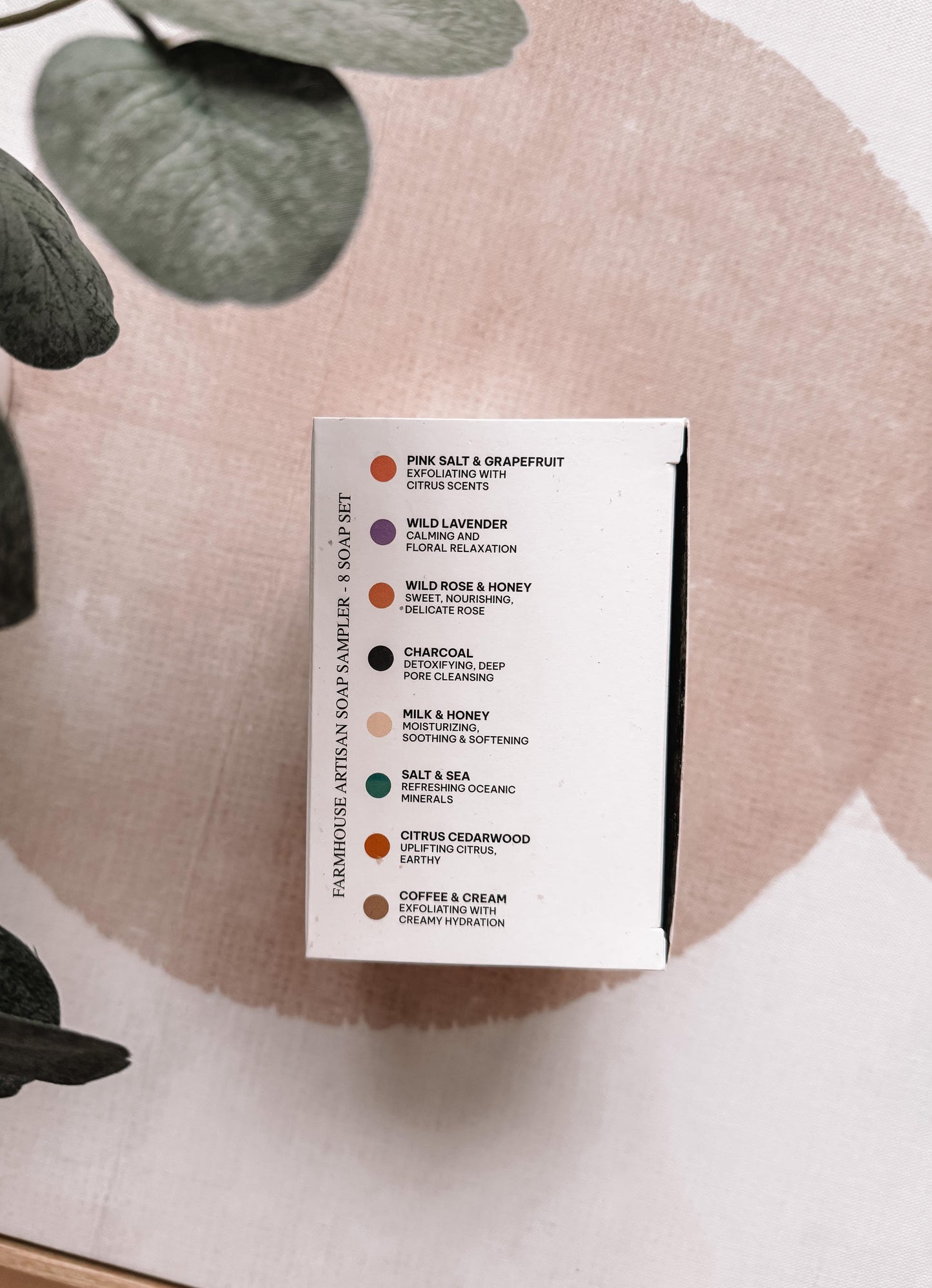 Product packaging with a list of scents on a decorative background