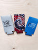 A collection of three can coolers. One is blue with the text 'Red, White & Booze' printed on it.