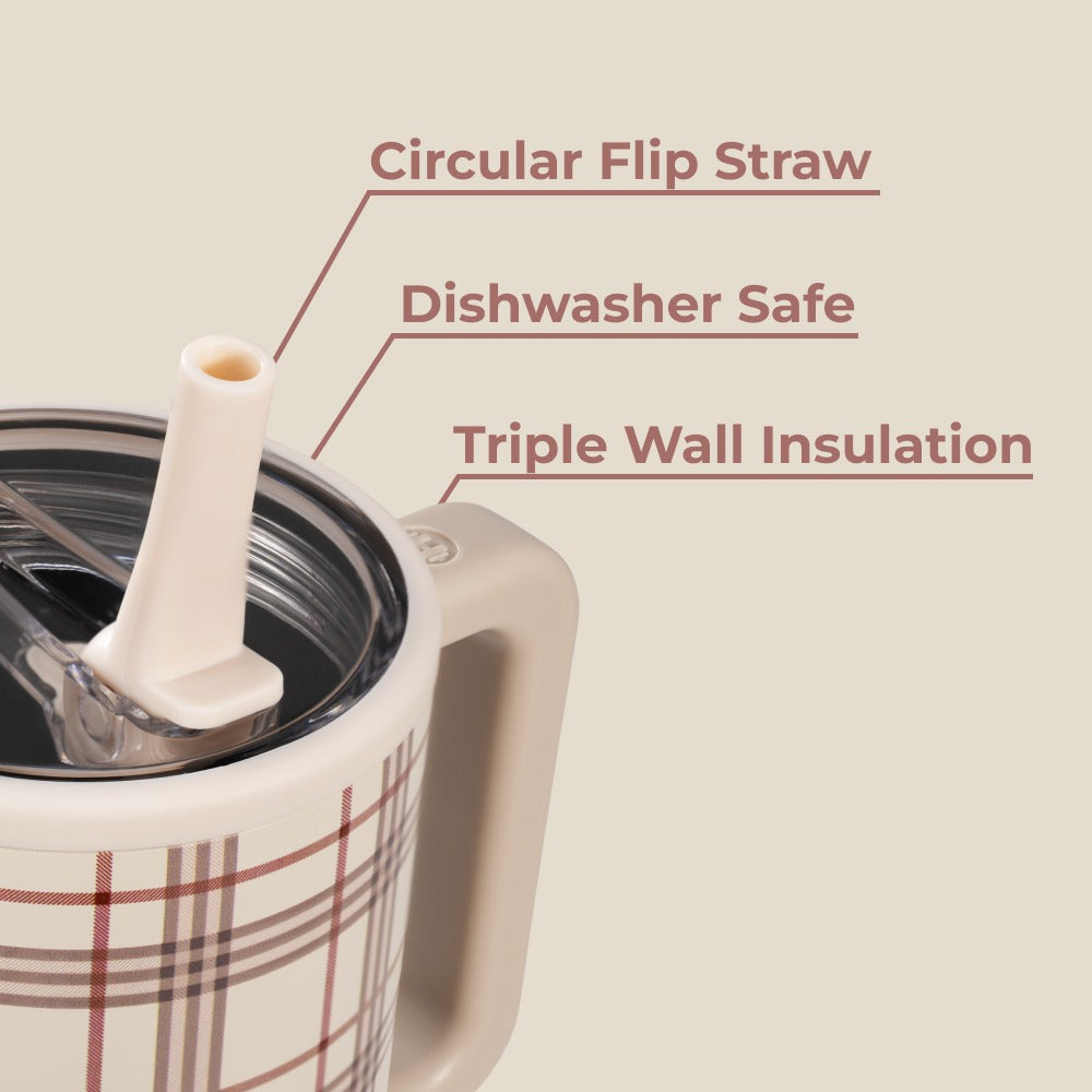 Plaid-patterned mug with a circular flip straw on a beige background