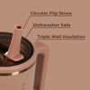Tumbler with circular flip straw, dishwasher safe, and triple wall insulation on a brown background