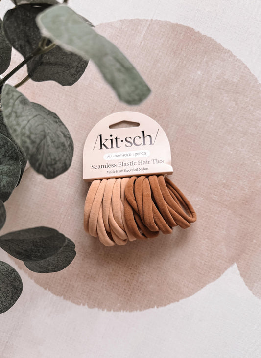 Pack of brown hair ties with 'kitsch' packaging on a neutral background