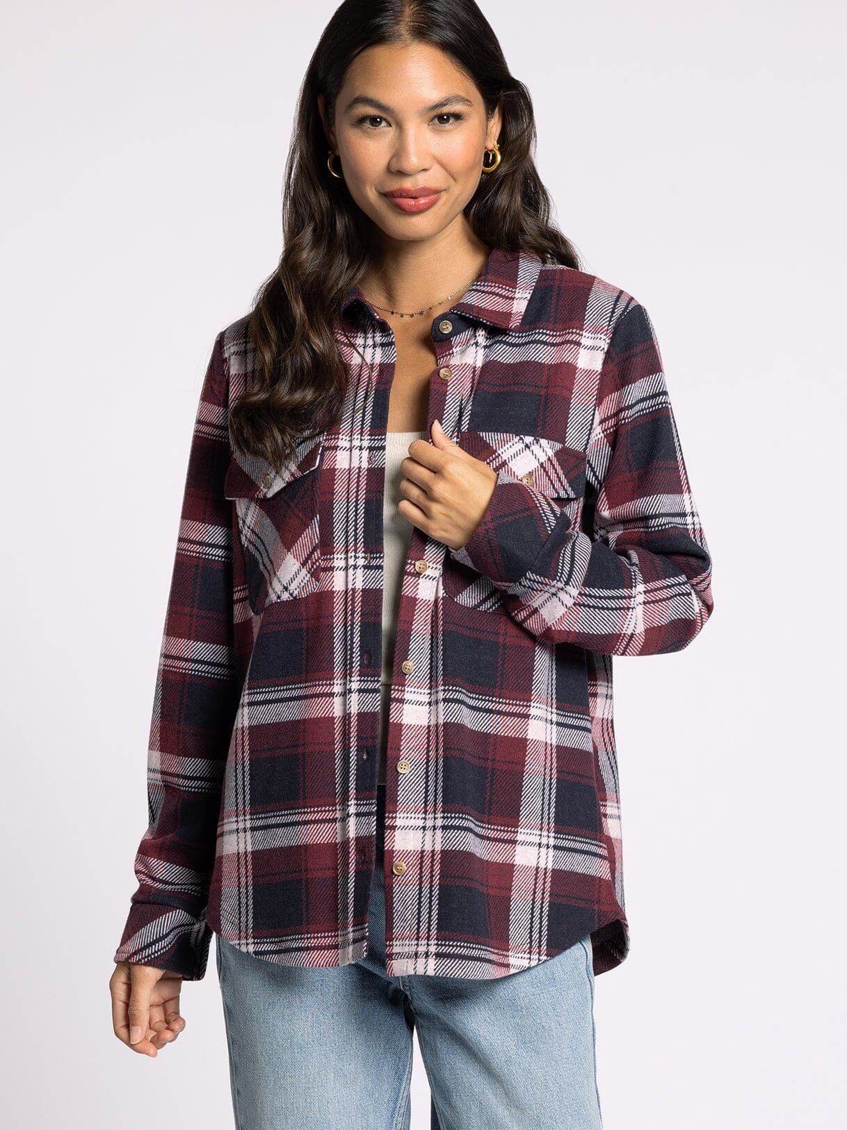 Woman wearing a plaid shirt on a white background