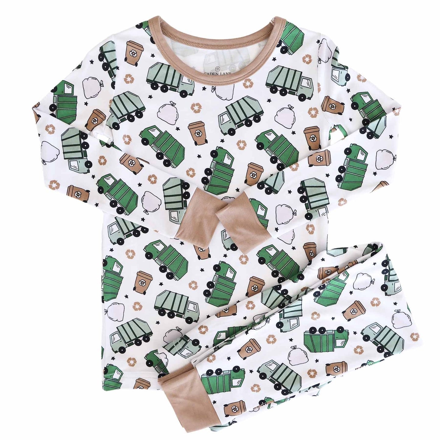 Children's pajama set with green garbage truck pattern on a white background