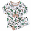 Children's pajama set with green garbage truck pattern on a white background