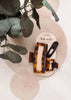 A hair accessory set by kit·sch on a cream-colored display card, styled with eucalyptus leaves. The set includes a large tortoiseshell clip, a smaller tortoiseshell clip, and a black paperclip-style hair clip.