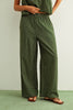 Green striped outfit worn by a person on a light green background