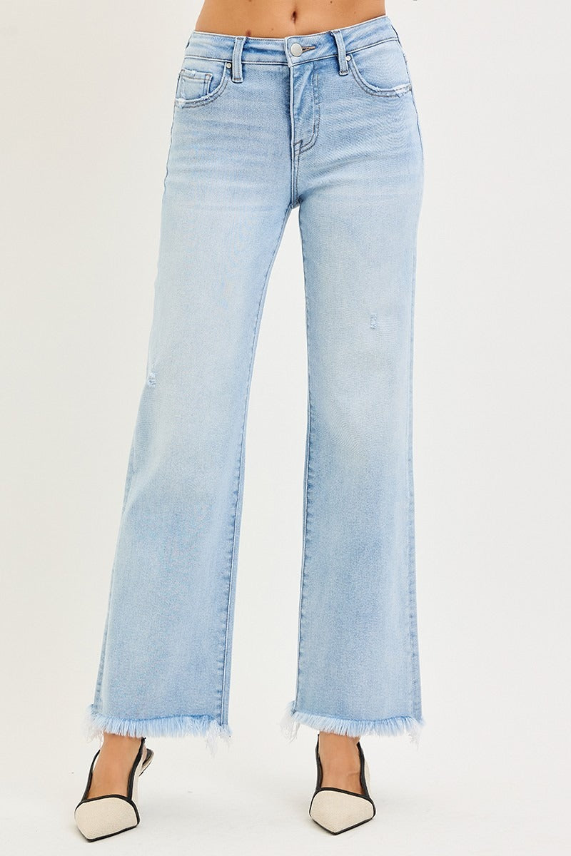 Light blue jeans with a white background