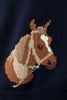 Navy sweater with a brown horse design on a dark background