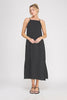 Woman wearing a black pinstripe dress on a white background
