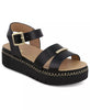 Black sandal with gold accents on a white background