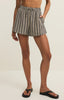Person wearing striped shorts on a plain background