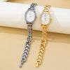 Two women's analog wristwatches with chunky chain straps, one in silver-tone metal and one in gold-tone metal, displayed on a beige surface with a white cylindrical prop. The brand name 'MAOU' is visible on the white dials.