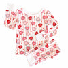 Children's pajama set with heart and stripe pattern on a white background