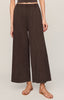 Brown wide-leg pants worn by a person on a plain background
