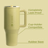 Beige travel mug with 'Hydro Flask' branding on a beige background