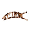 Tortoiseshell patterned hair clip on a white background