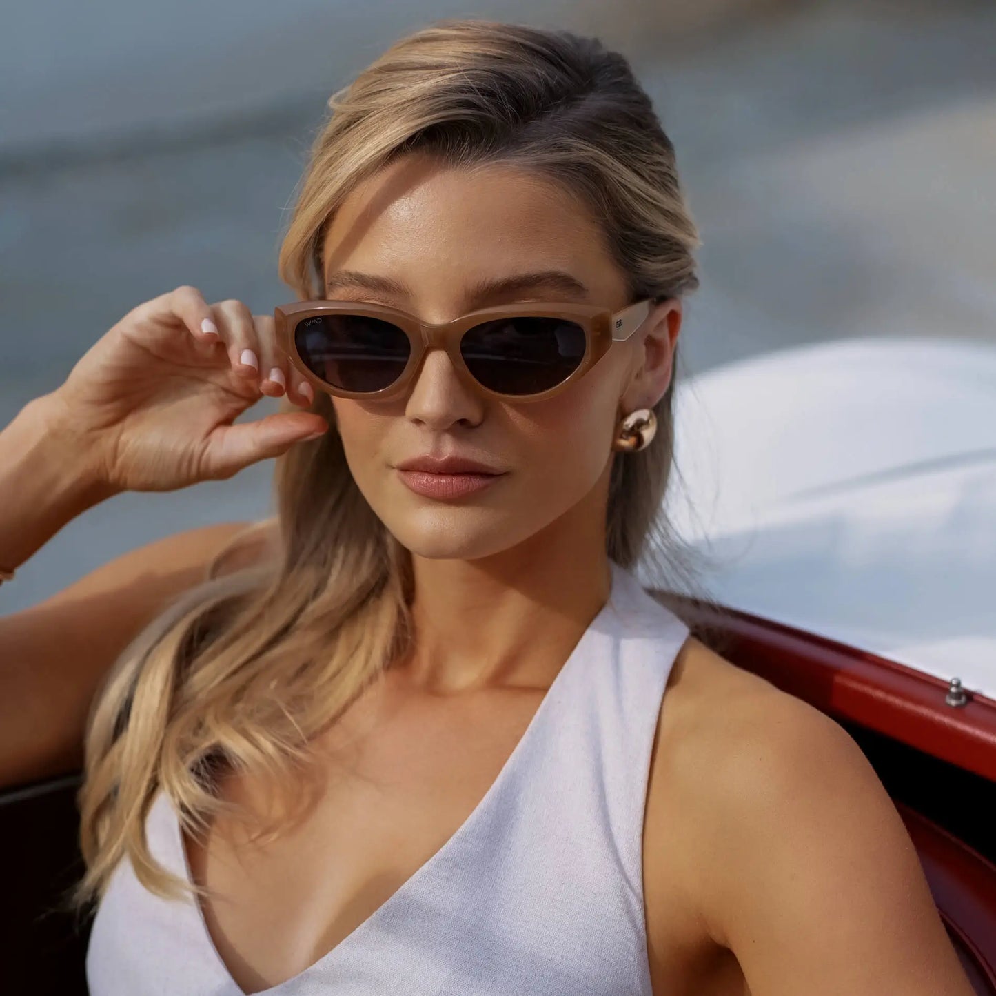 Woman wearing sunglasses with a blurred background