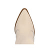 Close-up of a beige pointed-toe shoe on a white background
