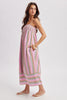 Woman wearing a striped pink dress on a white background