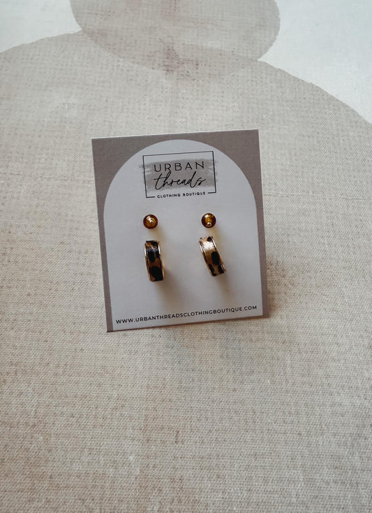 Set of earrings on a card with 'Urban Threads' branding on a textured beige background