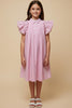 Young girl wearing a pink and white striped dress with ruffled sleeves on a beige background