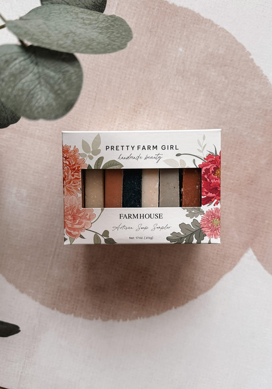 Pretty Farm Girl soaps on a neutral background with eucalyptus leaves.