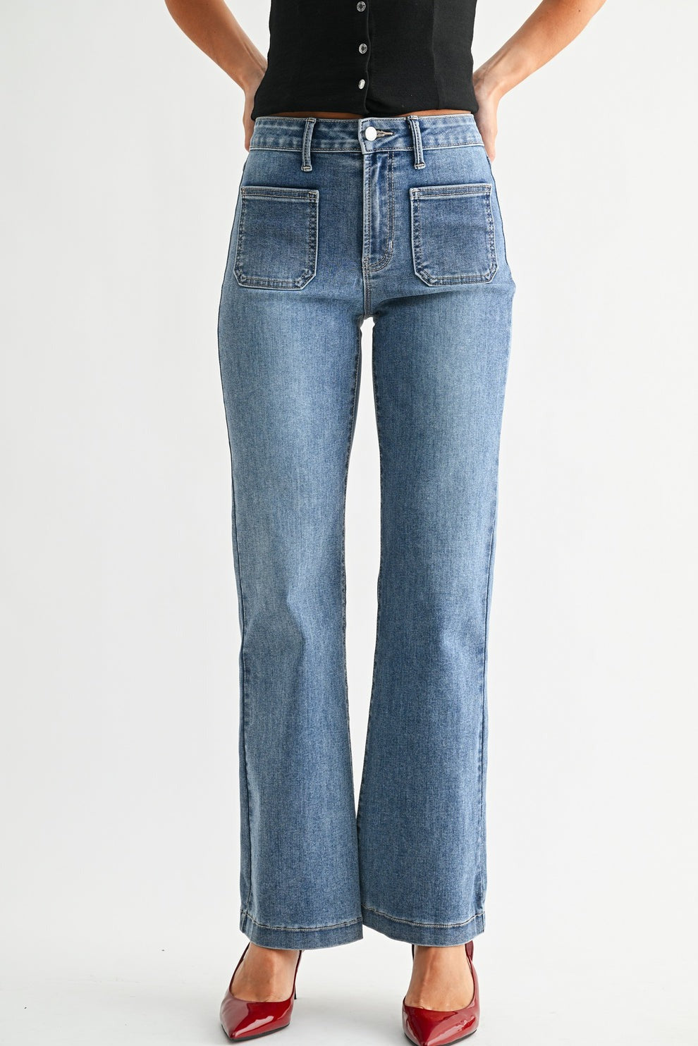 Light blue jeans worn by a person on a white background
