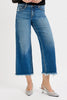 Person wearing blue jeans with a white background