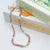 Beaded necklace on a box with 'Limes' and 'Oranges' text