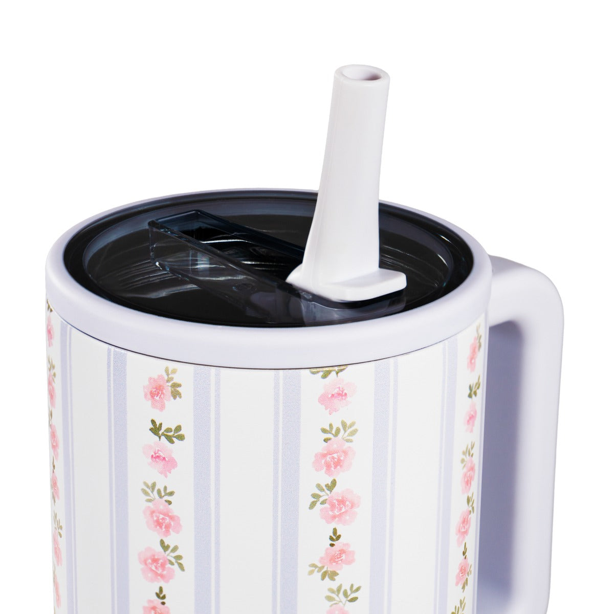 White mug with floral pattern, black lid, and white straw on a white background