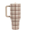 Plaid-patterned travel mug with beige handle on a white background