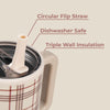 Plaid-patterned mug with a circular flip straw on a beige background