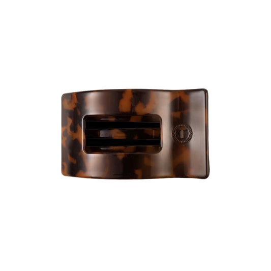 Tortoiseshell patterned hair clip on a white background