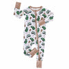 Baby onesie with green truck pattern and brown accents on a white background