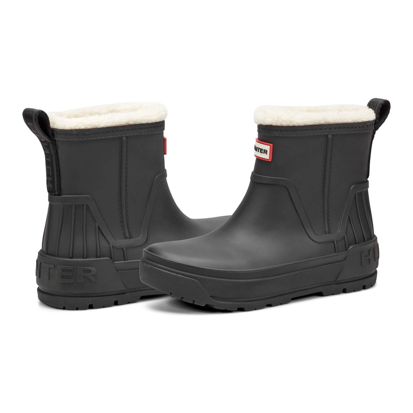 Pair of black rubber boots with white lining on a white background