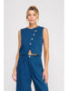 Woman wearing a blue sleeveless top with buttons and matching pants on a white background