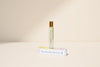 Banana Beach perfume bottle and packaging on a beige background
