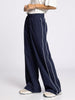 Navy wide-leg pants with a white stripe on a white background