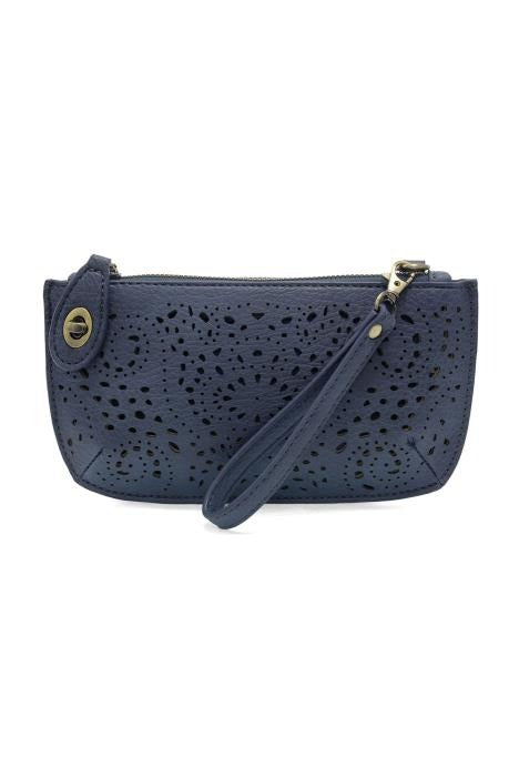 Navy blue perforated clutch bag with a strap on a white background